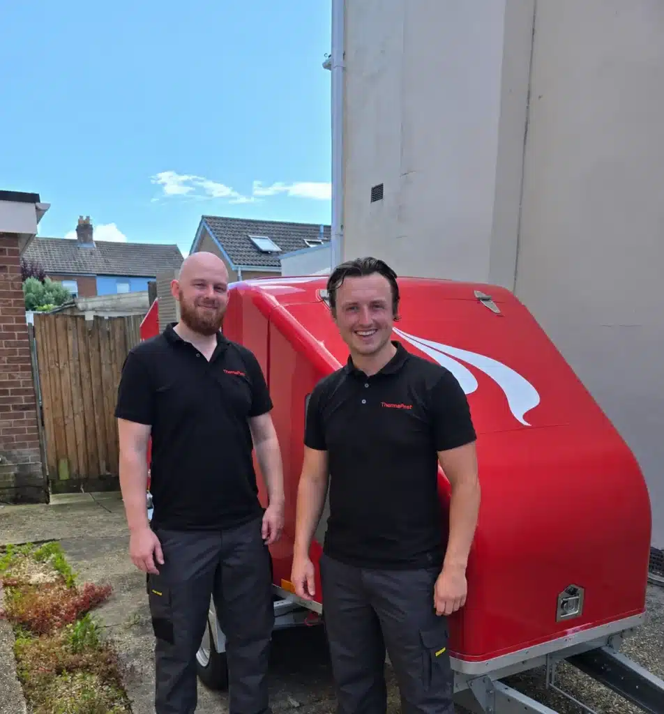 Two ThermoPest bed bug heat treatment specialists beside their heat treatment equipment, bed bug heat treatment experts in london